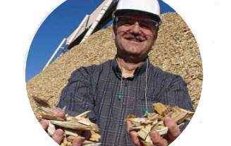 man holding wood chips