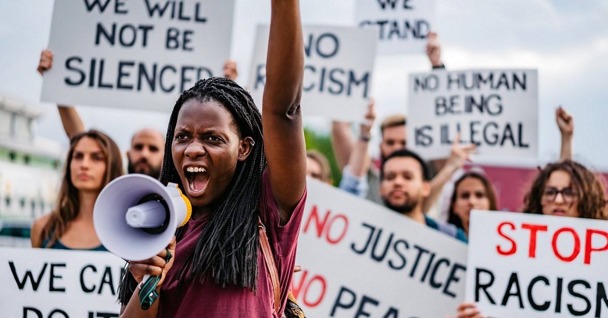 A woman leading a protest for racial justice