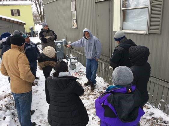 Slipstream building science expert Adrian Scott trains residents on winterizing their manufactured homes