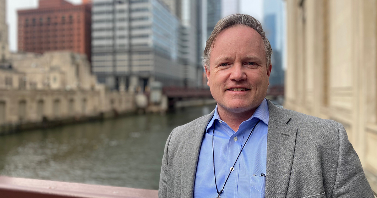 Joseph Clain in front of the Chicago River