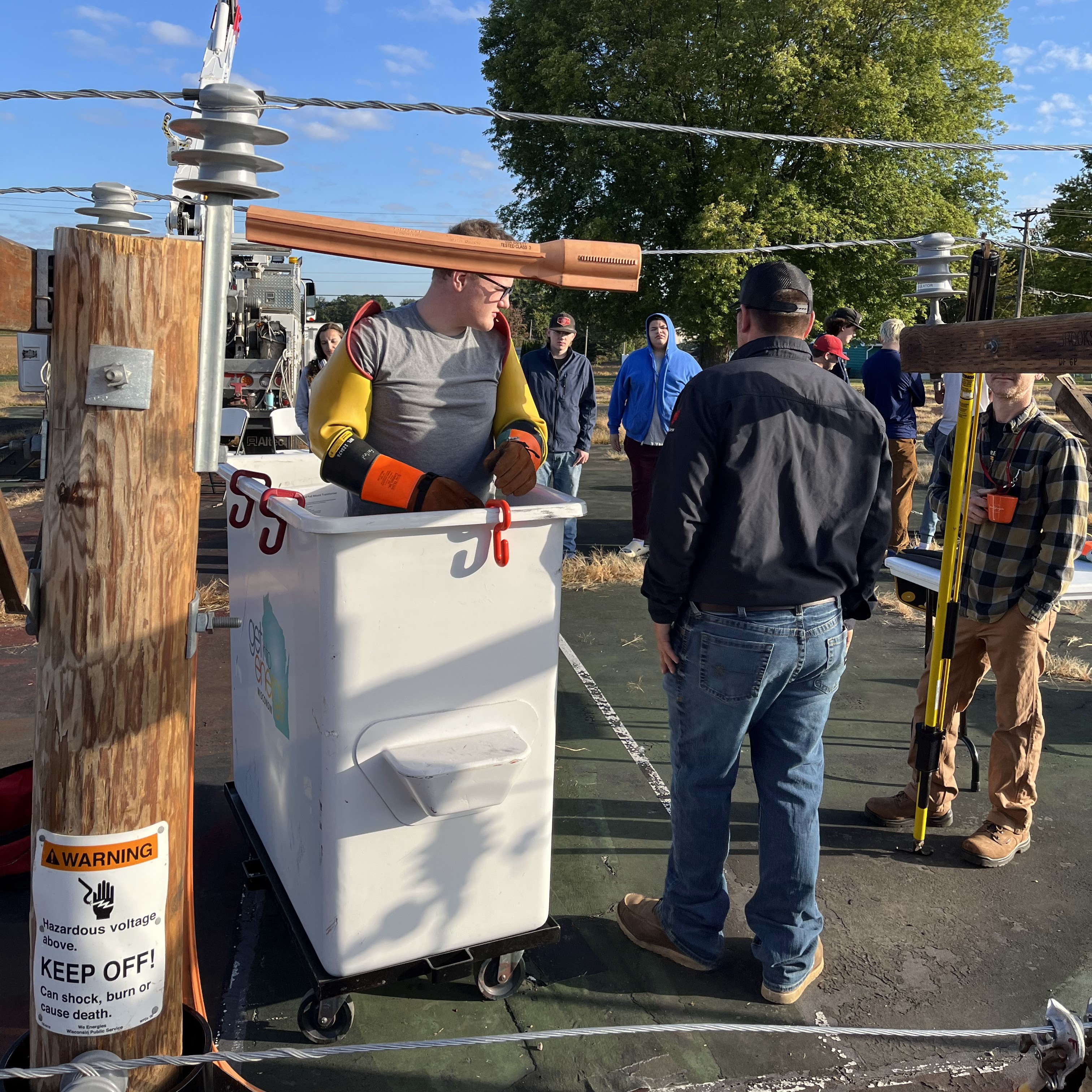 Worker standing in a replica of the bucket from a bucket truck