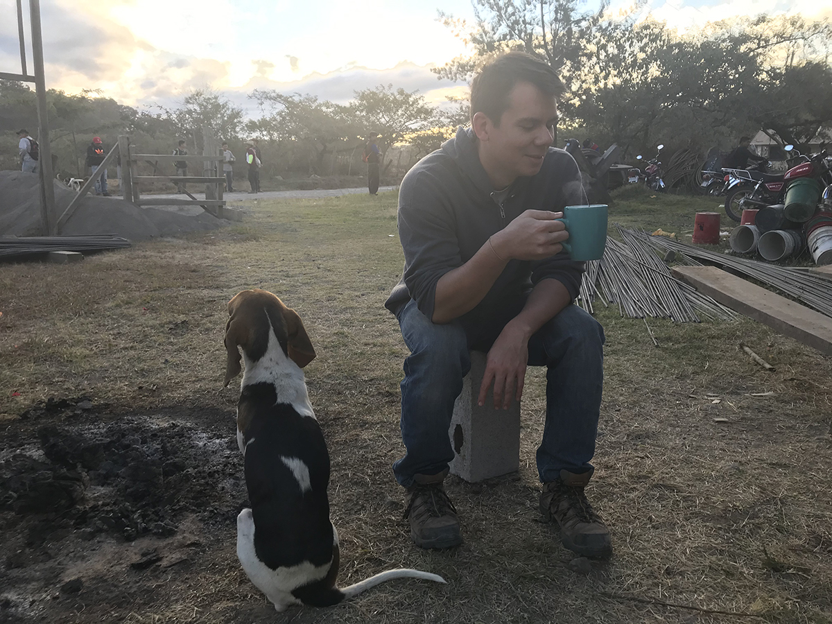 Kevin enjoying a cup of coffee made with clean water