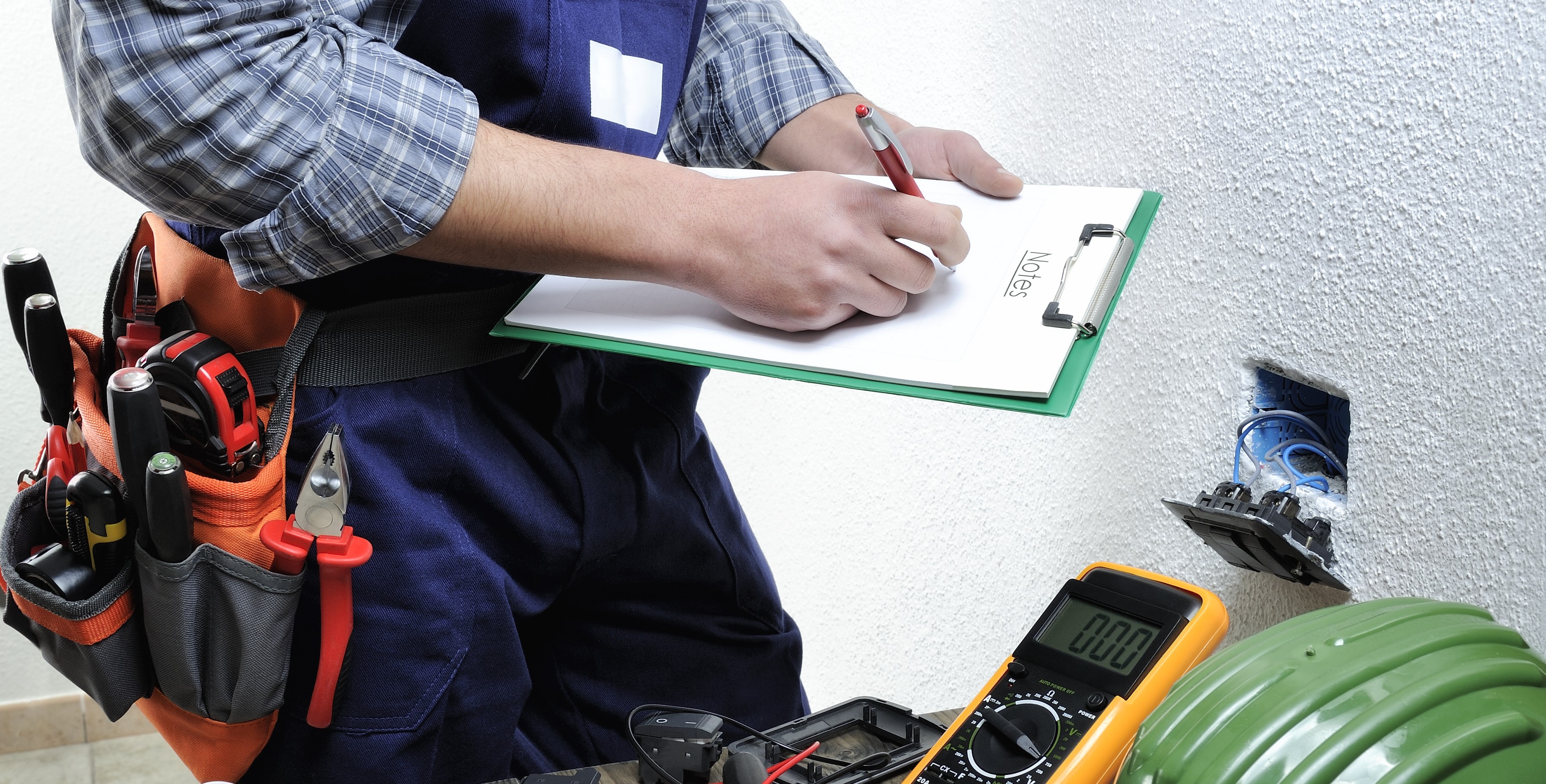 Professional electrician performing an installation in a residence