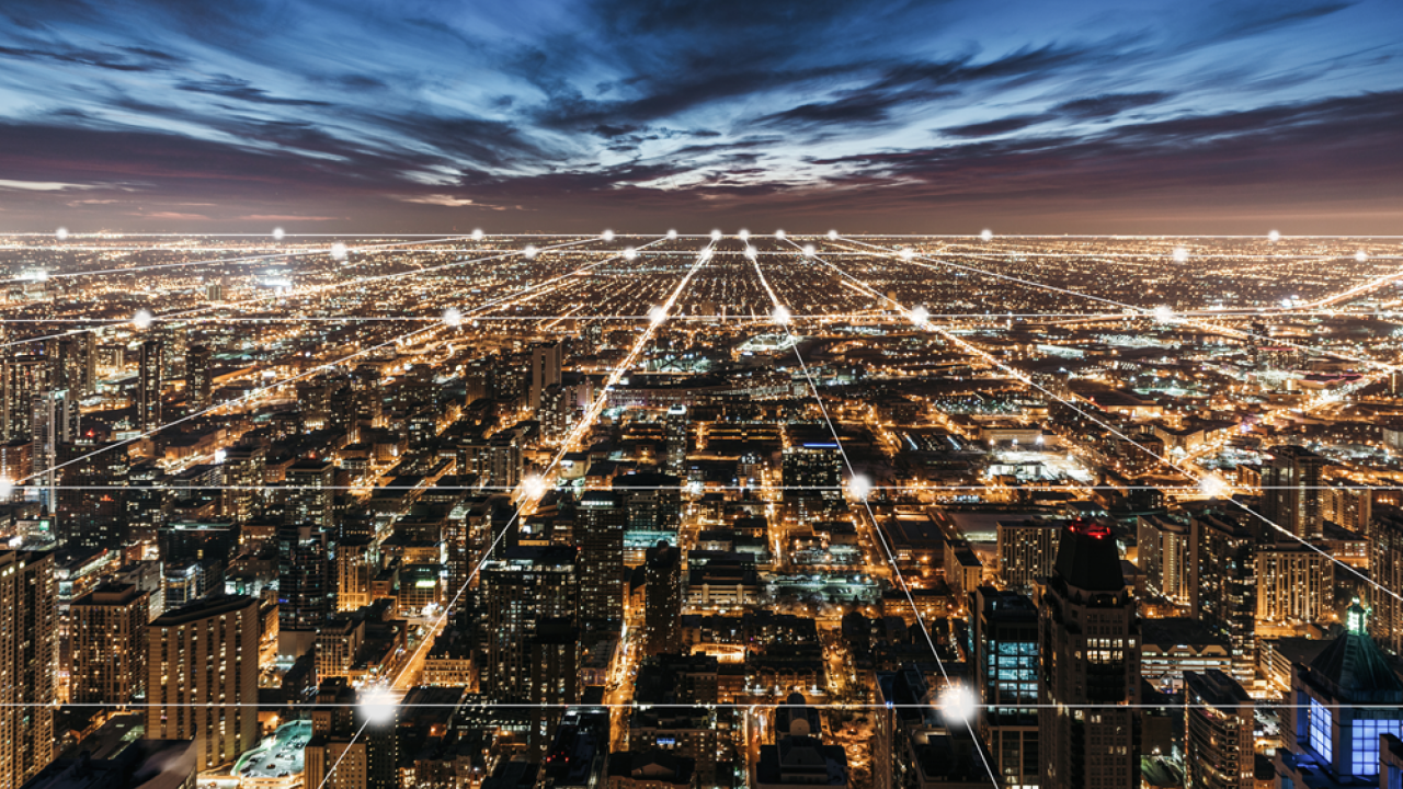 city at night symbolizing electric grid