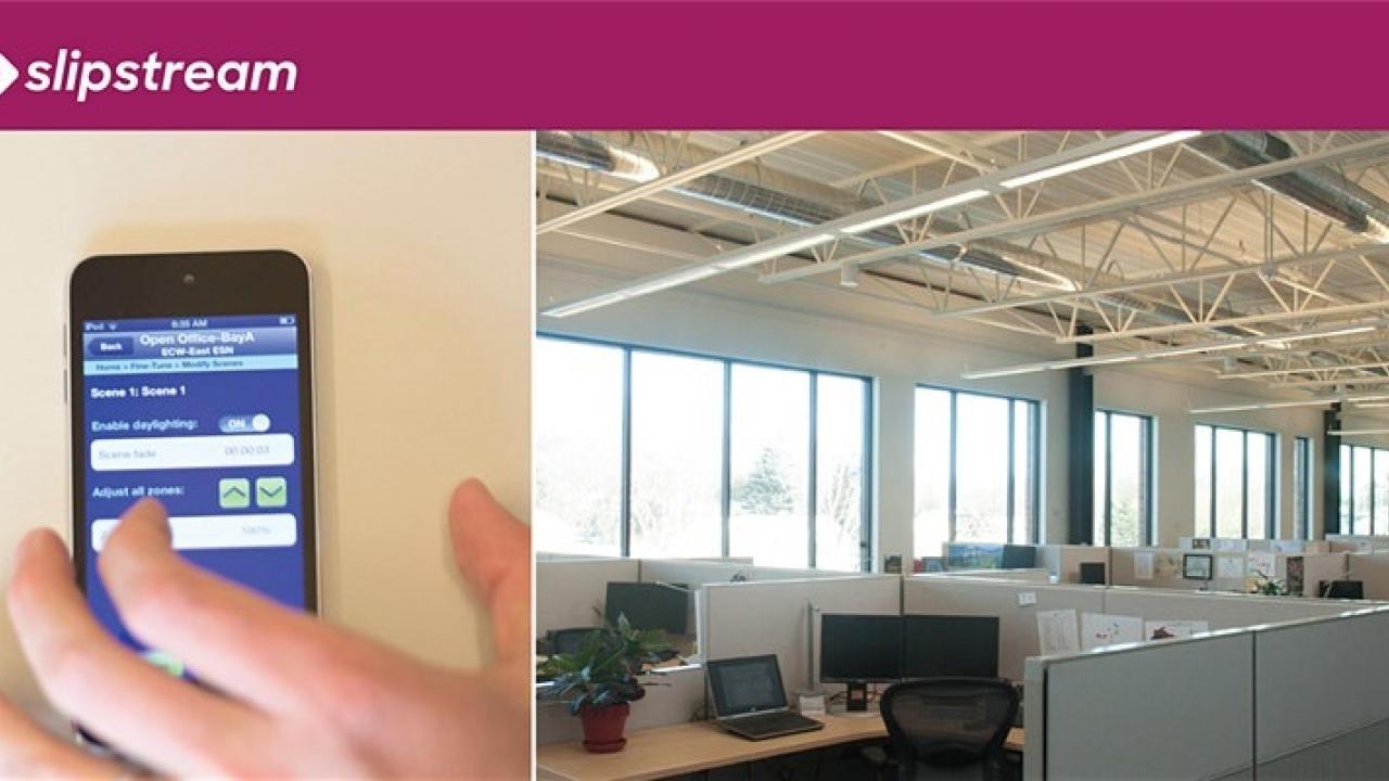 networked lighting controls app on mobile device next to office space lighting