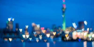 city skyline with blurred heart-shaped lights
