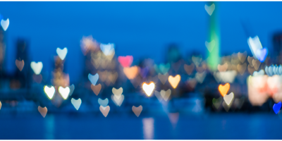 city skyline with blurred heart-shaped lights